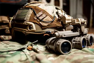 Special Forces FAST helmet with US flag equipped with panorama night vision goggles on a multicam pattern uniform.